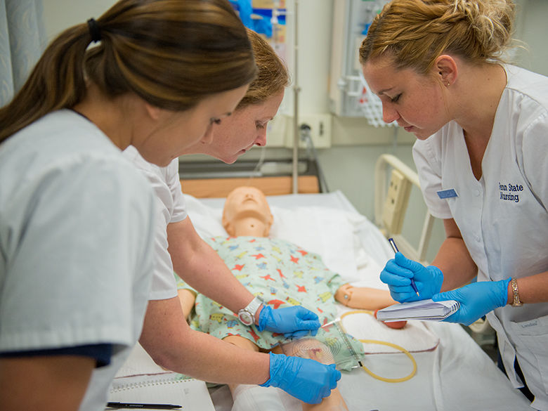 Penn State Mont Alto nursing students work on a dummy patient