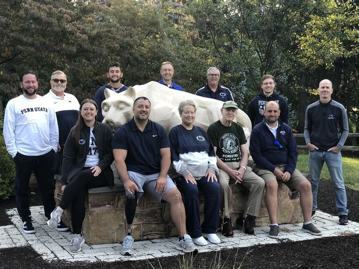 2023 Mont Alto Alumni Society Board of Directors stand around the Nittany Lion Shrine
