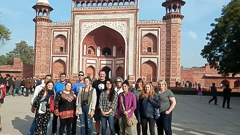 The group gathers at the entrance to the Taj Mahal.