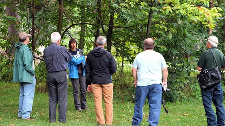 Dr. Beth Brantley shows members of the Cumberland Woodland Owners Association a grove of Chinese chestnut and American chestnut trees on the Penn State Mont Alto campus.