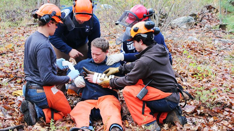 Penn State Mont Alto forest technology students provide first aid during trauma-scenario training event.