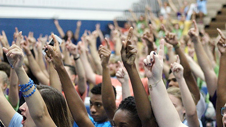 Penn State Mont Alto students hold up their hands during Jon Vroman's talk.