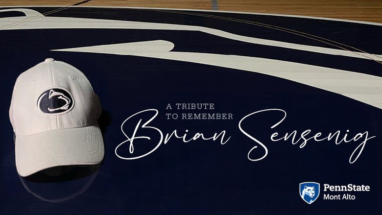 "A tribute to remember Brian Sensenig" next to a white Penn State cap