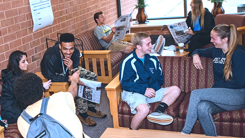 Penn State students share conversation in lounge area
