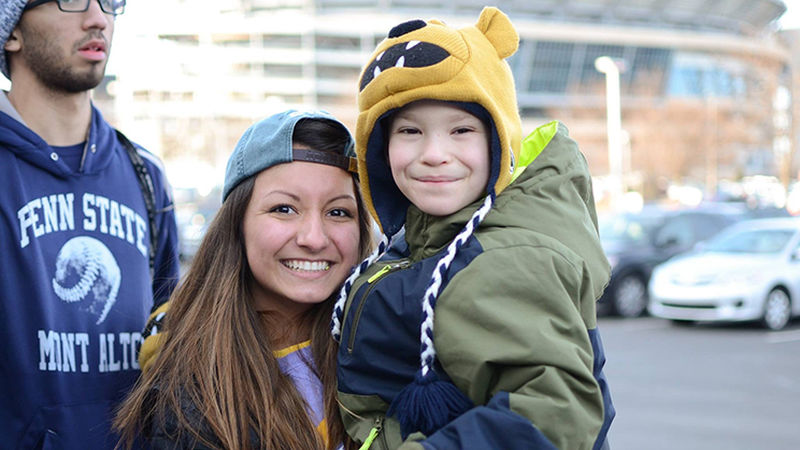 THON Dancer Keighley Taylor holds THON benefits recipient Austin Lightner THON Dancer Keighley Taylor holds THON benefits recipient Austin Lightner