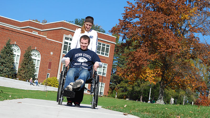 PTA Students practice hands-on skills with a wheelchair PTA Students practice hands-on skills with a wheelchair
