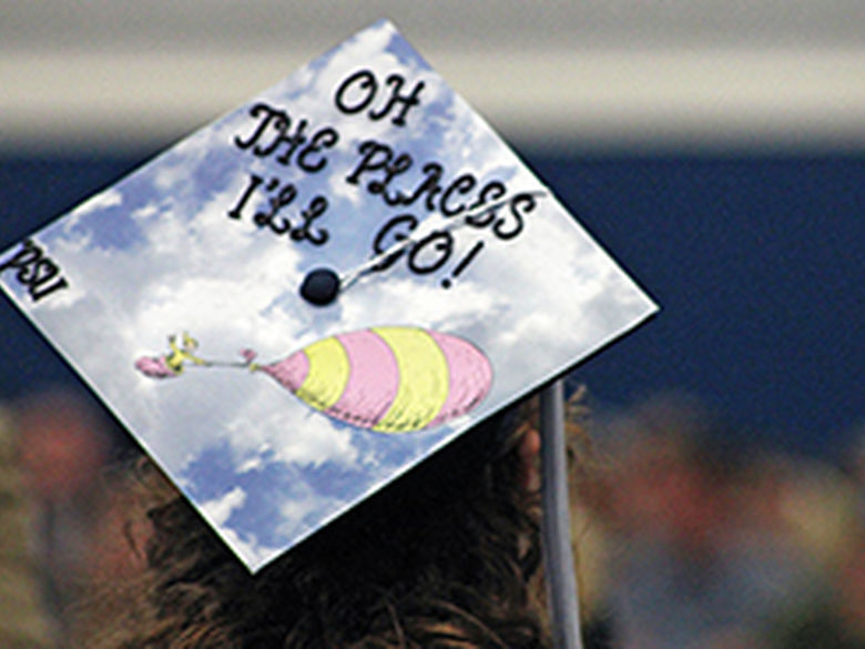 A Penn State Mont Alto grad dons a decorated mortar board at commencement