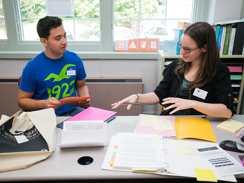 A Penn State Mont Alto adviser helps a student with paperwork.