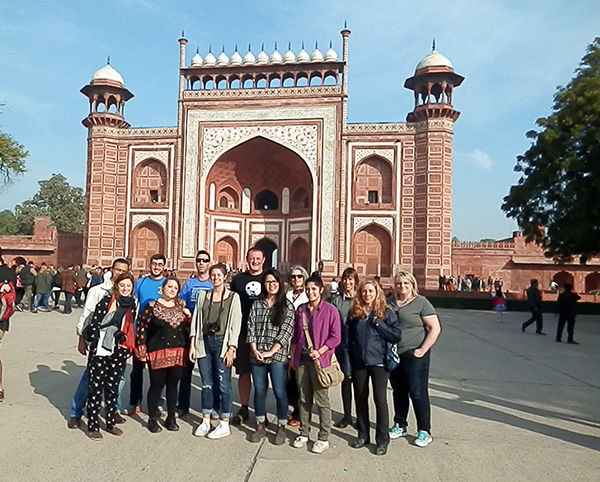 The group gathers at the entrance to the Taj Mahal.