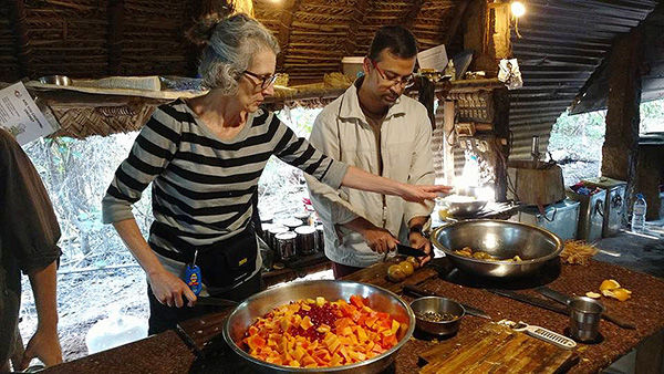 Penn State Mont Alto faculty members Deborah Mirdamadi and Somjit Barat prepare a vegan meal at Sadhana Forest.