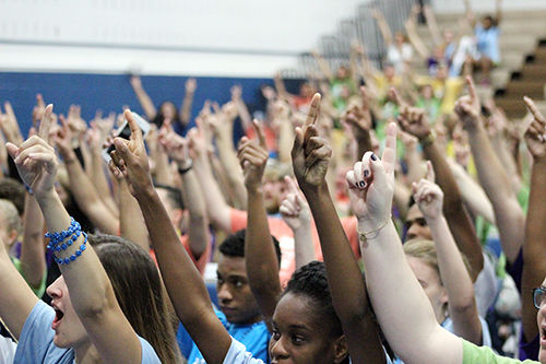 Penn State Mont Alto students hold up their hands during Jon Vroman's talk.