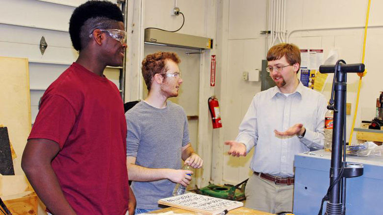 Faculty member discusses engineering design with students
