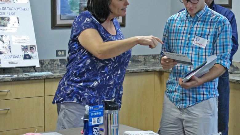 Penn State Mont Alto Bookstore director shares information with student at NSO