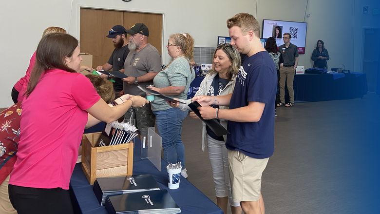 Students and their families receiving Penn State SWAG
