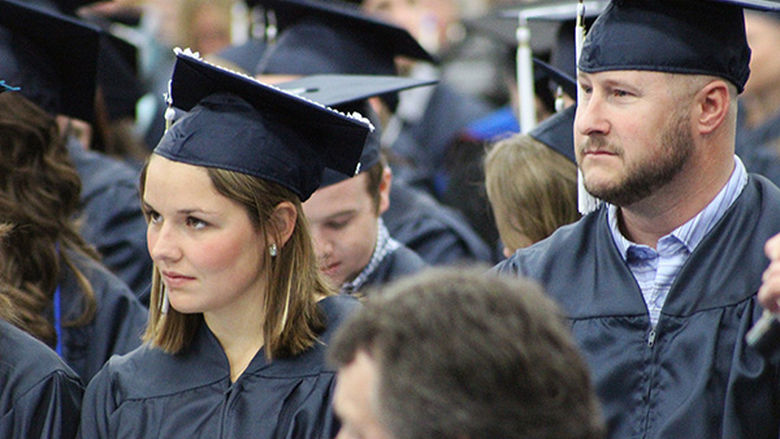 Penn State Mont Alto graduates wait to receive their diplomas.