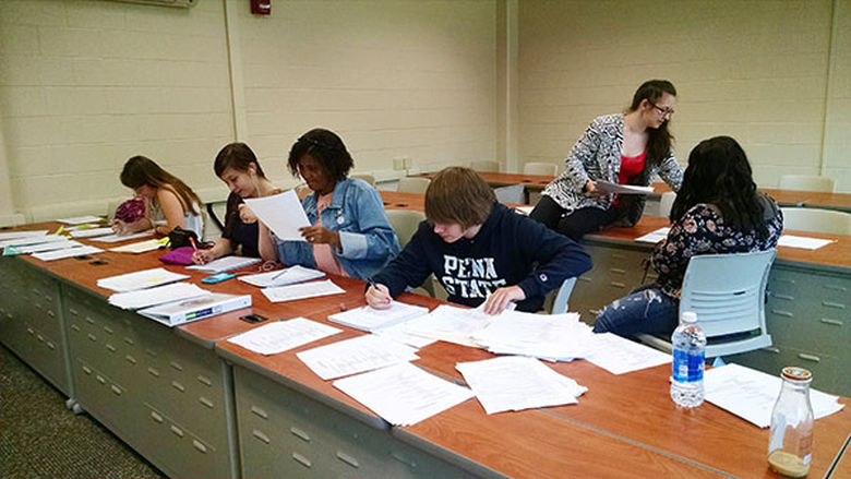 Students tally the results of a tobacco policy survey at Penn State Mont Alto.