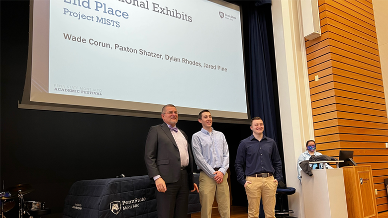 Male students pose with Mike Doncheski during the awards presentation. 