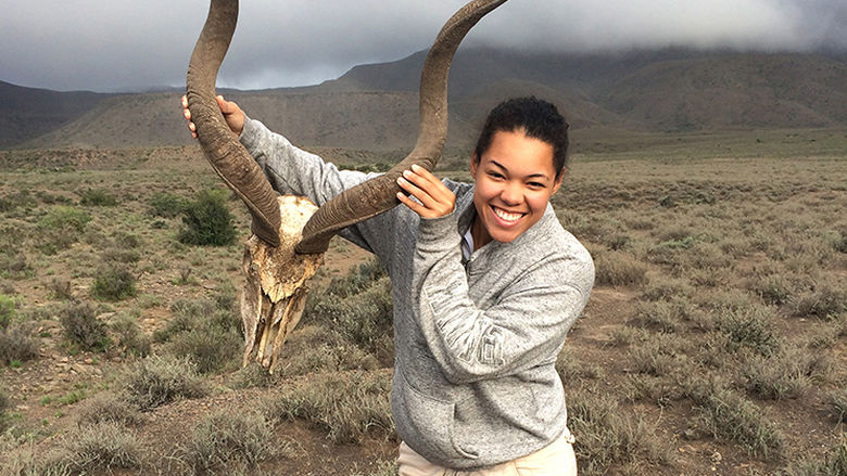 Erica Newton with the skull of a kudu in South Africa