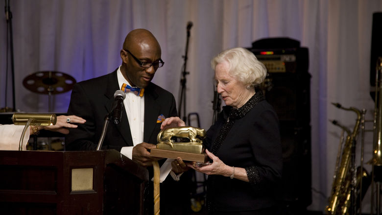 Dr. Achampong presenting an award for philanthropy to Carolyn Eberly-Blaney