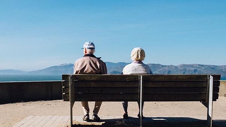 Aging couple on bench.