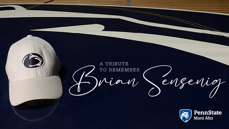 "A Tribute to Brian Sensenig" next to white Penn State cap. 