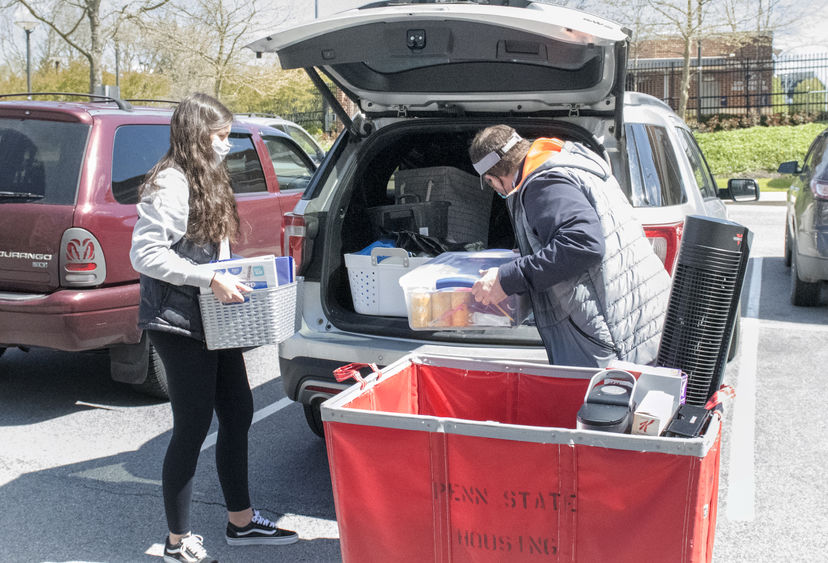 Student packing belongings in car