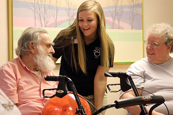 OTA student Haylee Dietrich with Trinity House Resident. OTA student Haylee Dietrich with Trinity House Resident.