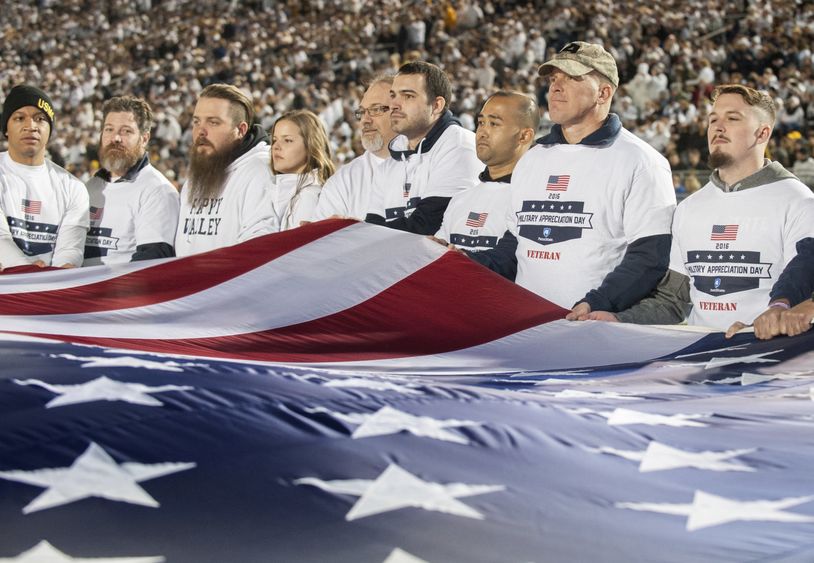 Veterans hold flag