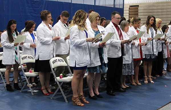 Mont Alto nursing students read the "Nightingale Pledge." Mont Alto nursing students read the "Nightingale Pledge."