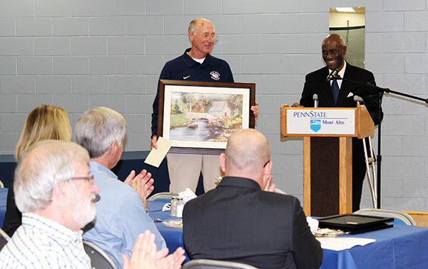 Robert (Marty) Ogle is honored during Penn State Mont Alto's End-of-year Luncheon.