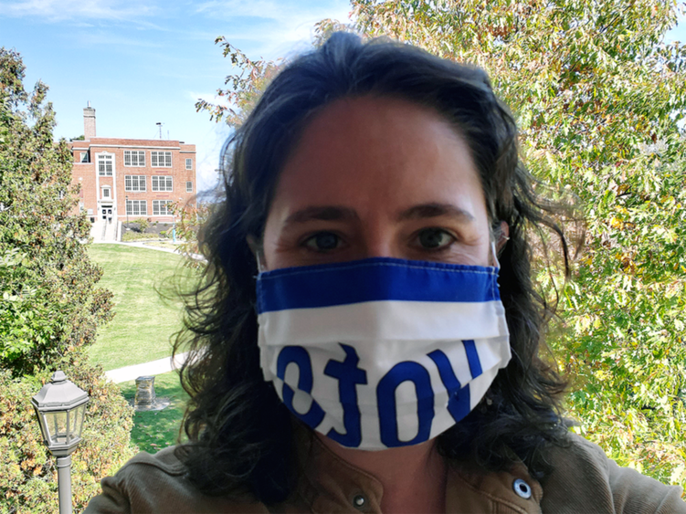 Female professor wearing mask with "Vote"