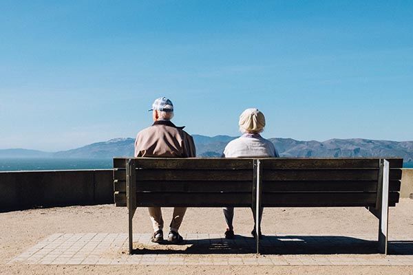 Aging couple on bench.