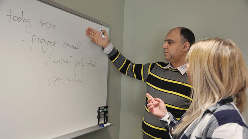 Penn State Mont Alto Project and Supply Chain Management Instructor and student work together in classroom