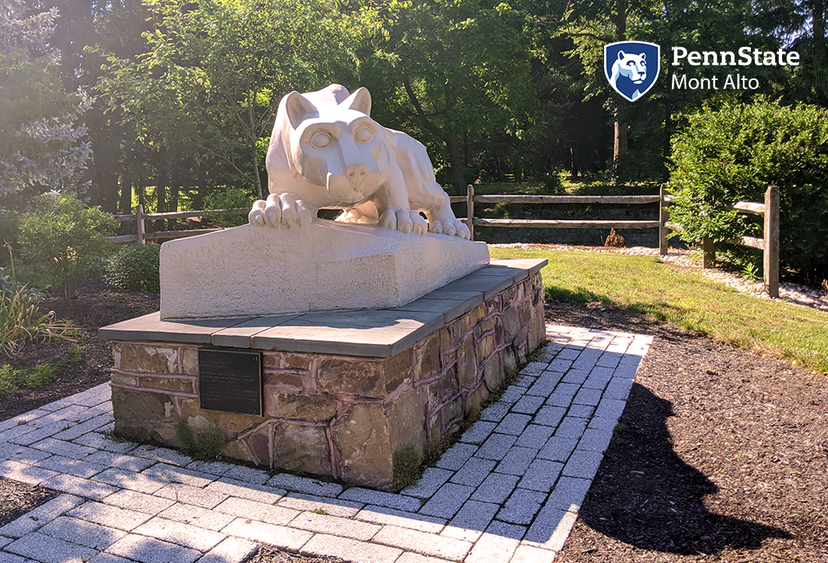 Sunny photo of shrine with Penn State Mont Alto logo